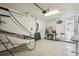 Well-lit garage featuring an air hockey table and ample storage at 1119 Mariner Cay Dr, Haines City, FL 33844