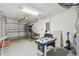 Neat garage featuring an air hockey table, storage, and a clean interior at 1119 Mariner Cay Dr, Haines City, FL 33844