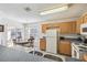 Well-lit kitchen with an adjacent dining area and sliding glass doors to the screened patio at 1119 Mariner Cay Dr, Haines City, FL 33844