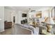 Spacious living room with a flat screen tv and views to the kitchen and staircase at 1119 Mariner Cay Dr, Haines City, FL 33844