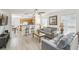 Open-concept living area with a comfortable seating area and views into the adjacent kitchen at 1119 Mariner Cay Dr, Haines City, FL 33844