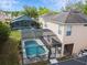 Aerial view of the house showing a large, screened-in pool and back yard at 1119 Mariner Cay Dr, Haines City, FL 33844