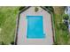 Inviting aerial view of a sparkling community pool surrounded by lush landscaping at 1119 Mariner Cay Dr, Haines City, FL 33844