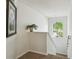 Well-lit stairway with decorative plant and artwork, leading to upper level at 1119 Mariner Cay Dr, Haines City, FL 33844