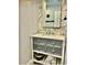 Stylish bathroom vanity with gray cabinets, marble countertop, and tiled backsplash at 1122 Spaceport Ct, Kissimmee, FL 34741