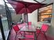 Screened-in patio with a dining table, chairs, and a view of the outdoor space at 1122 Spaceport Ct, Kissimmee, FL 34741