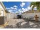 Private backyard patio with paver stones, white fence, and decorative fountain; an ideal outdoor space at 11242 Stone Gate Ct, Orlando, FL 32837