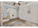 Comfortable bedroom with wood-look flooring and a spacious closet at 11242 Stone Gate Ct, Orlando, FL 32837