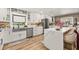 Modern kitchen featuring white cabinets, a kitchen island, and stainless steel appliances at 11242 Stone Gate Ct, Orlando, FL 32837