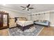 Spacious bedroom with a ceiling fan, and a sliding door closet at 11242 Stone Gate Ct, Orlando, FL 32837