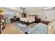 Large main bedroom with a ceiling fan, natural light, and neutral tones at 11242 Stone Gate Ct, Orlando, FL 32837