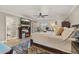 Comfortable main bedroom with en suite bathroom and ceiling fan at 11242 Stone Gate Ct, Orlando, FL 32837