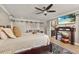 Serene main bedroom featuring a ceiling fan and flat screen television at 11242 Stone Gate Ct, Orlando, FL 32837