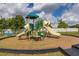 Community playground featuring slides and climbing structures for outdoor fun and recreation at 11242 Stone Gate Ct, Orlando, FL 32837