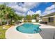 Freeform pool and spa featuring mature landscaping and ample patio space at 11242 Stone Gate Ct, Orlando, FL 32837