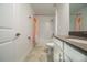 Bright bathroom featuring white fixtures, gray countertop, and shower/tub combo with modern hardware at 11456 Rhyme Ave, Orlando, FL 32832
