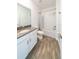 Clean bathroom featuring white cabinets, a gray countertop, and a shower-tub combination at 11456 Rhyme Ave, Orlando, FL 32832
