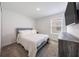 Bright bedroom featuring a comfy bed, a dresser, and natural light at 11456 Rhyme Ave, Orlando, FL 32832