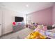 bedroom features fun decor, a toy shelf, and a large window at 11456 Rhyme Ave, Orlando, FL 32832