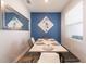 Stylish dining area features a modern table, trendy seating, and an eye-catching blue accent wall at 11456 Rhyme Ave, Orlando, FL 32832