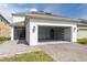 View of the garage, lanai, and backyard of this home at 11456 Rhyme Ave, Orlando, FL 32832
