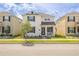 Charming two-story home featuring black shutters, a porch, and a well-manicured front yard at 11456 Rhyme Ave, Orlando, FL 32832