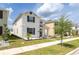 Attractive two-story home boasts a welcoming front porch and beautifully maintained landscaping at 11456 Rhyme Ave, Orlando, FL 32832