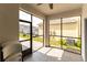 Covered lanai featuring tile flooring, exterior access, and a ceiling fan at 11456 Rhyme Ave, Orlando, FL 32832