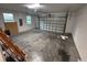 Attached garage with roll up door and room for multiple cars or storage at 1400 Fair Oaks Ave, Kissimmee, FL 34744
