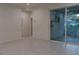 Spacious living room with tile flooring and sliding glass doors leading to an outdoor patio at 1400 Fair Oaks Ave, Kissimmee, FL 34744