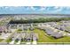Aerial view showcasing a neighborhood with well-maintained lawns and similar style homes at 1507 Bitteroot St, Kissimmee, FL 34744