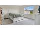 Cozy bedroom with plush carpet and a large window providing natural light at 1507 Bitteroot St, Kissimmee, FL 34744