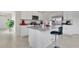 Modern kitchen boasts white cabinets, granite countertops, and stainless steel appliances at 1507 Bitteroot St, Kissimmee, FL 34744