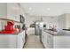 Well-equipped kitchen with granite counters, stainless steel appliances, and white cabinetry at 1507 Bitteroot St, Kissimmee, FL 34744