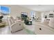Bright living room with tile floors, natural light, and a comfortable reclining sofa at 1507 Bitteroot St, Kissimmee, FL 34744