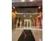 Exterior building entrance of Soliare at the Plaza with glass doors and an awning at 155 S Court Ave # 1308, Orlando, FL 32801