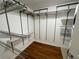 Large walk-in closet with wire shelving and hardwood floors at 155 S Court Ave # 1308, Orlando, FL 32801