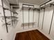 Organized closet with adjustable shelving system and hardwood floors at 155 S Court Ave # 1308, Orlando, FL 32801