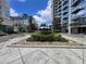 Beautifully landscaped courtyard with lush greenery, palm trees, and walking space at 155 S Court Ave # 1308, Orlando, FL 32801