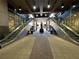 Wide angle view of symmetrical entrance with dual escalators and public art at 155 S Court Ave # 1308, Orlando, FL 32801