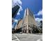 Contemporary high-rise building with a mix of commercial and residential spaces, located at a busy intersection at 155 S Court Ave # 1308, Orlando, FL 32801