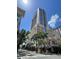 Towering building with a modern design featuring large glass windows, standing tall on a sunny day at 155 S Court Ave # 1308, Orlando, FL 32801