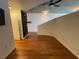 Open living room with hardwood floors and modern architectural details at 155 S Court Ave # 1308, Orlando, FL 32801