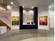 Modern lobby area with coffee station, wall art, and polished floors at 155 S Court Ave # 1308, Orlando, FL 32801