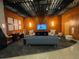 A contemporary lounge area features modern furniture, a TV, and stylish decor for relaxation and entertainment at 155 S Court Ave # 1308, Orlando, FL 32801