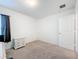 Neutral bedroom featuring neutral carpet, window with curtains, and a white dresser near doorway at 16588 Centipede St, Clermont, FL 34714