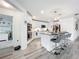 Stylish, well-lit kitchen with white cabinets, stainless steel appliances, and an island breakfast bar at 16588 Centipede St, Clermont, FL 34714