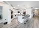 Bright, modern kitchen featuring stainless steel appliances, granite countertops, and an island with bar seating at 16588 Centipede St, Clermont, FL 34714