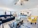 Open-concept living room seamlessly connects to the kitchen with bar seating at 16588 Centipede St, Clermont, FL 34714