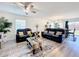 Spacious living room with modern furnishings and wood-look floors at 16588 Centipede St, Clermont, FL 34714